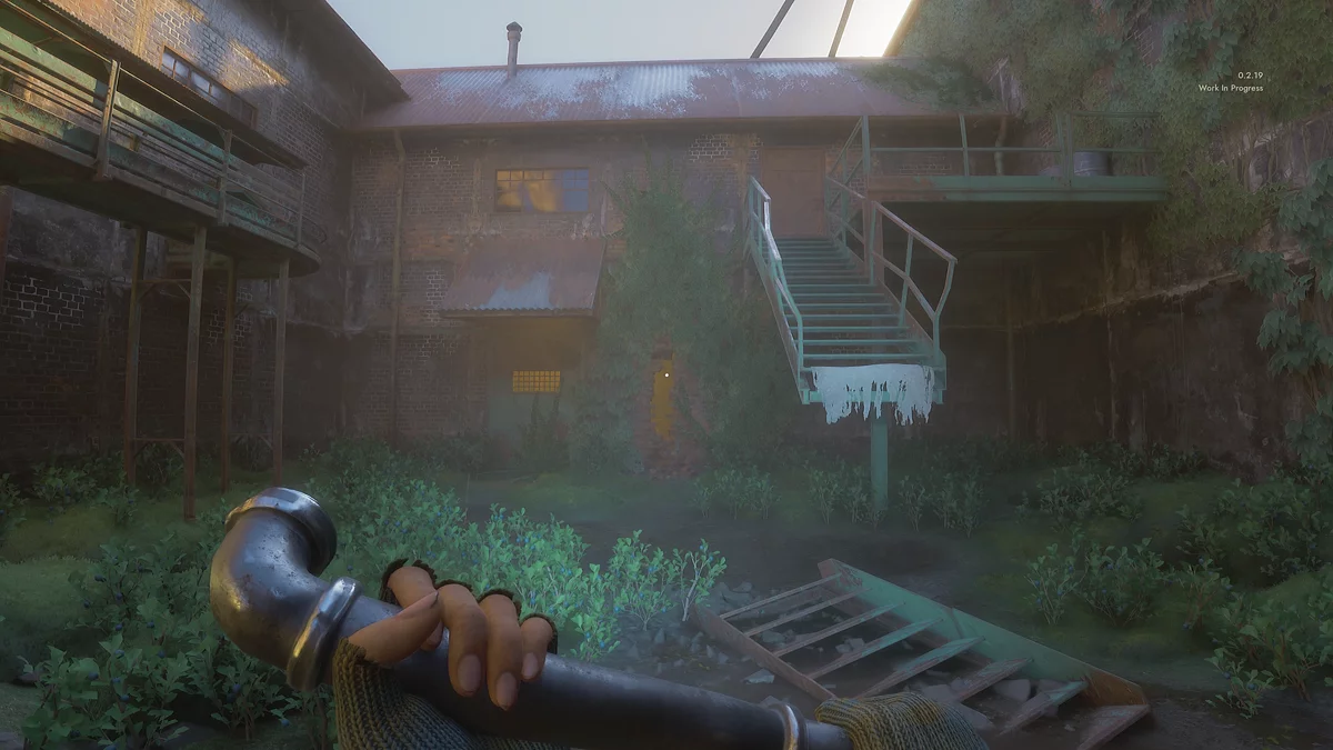 The factory entrance is under the stairs